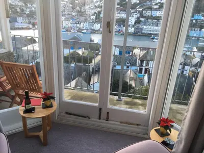 a room with a window with a view of a city at Penwyn Bed and Breakfast in Looe