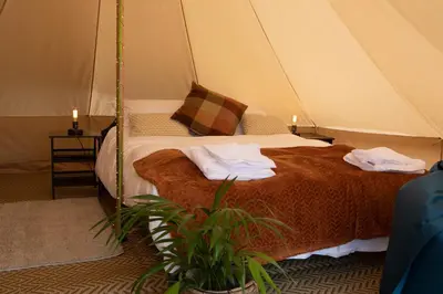 a bedroom with a bed in a tent at Three Tuns in Helston