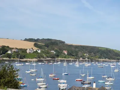 a bunch of boats sitting in the water at Roland Cottage in Falmouth