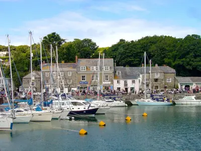 a group of boats are docked in a harbor at Trevone in St Merryn