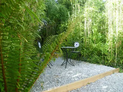 a table in the middle of a garden at Rawley point in Newquay
