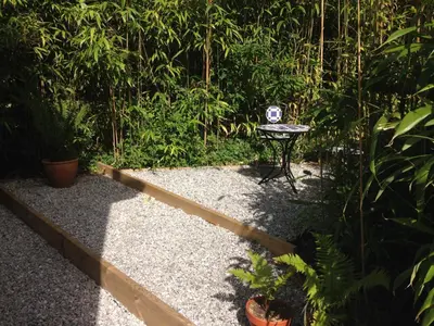 a garden with a table and some plants at Rawley point in Newquay