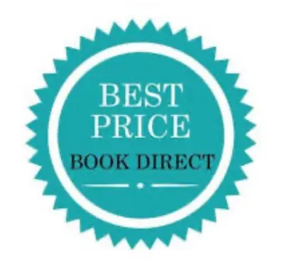 a sign that reads best price book direct at Lazy Waves in Newquay