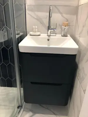 a bathroom with a sink and a shower at Lazy Waves in Newquay