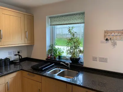 a kitchen with a sink and a window at OHANA HOUSE - Unbeatable Location - UK's Best Beaches in Newquay