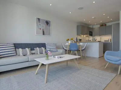 a living room with a couch and a table at Rosen in Crantock