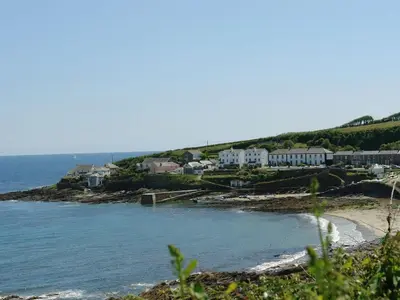 a view of a beach with houses and the ocean at Blue Seas in Saint Mawes