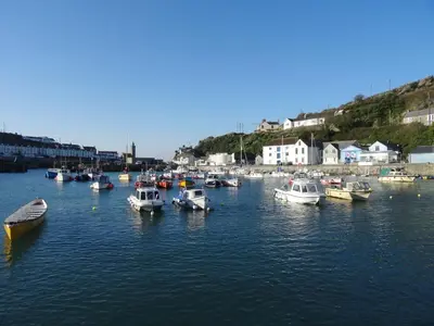 a group of boats docked in a body of water at The Hayloft in Breage