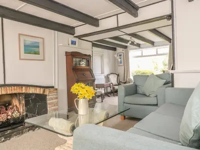 a living room with a couch and a fireplace at Boundys House in St Ives