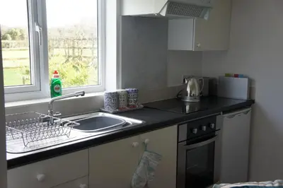 a kitchen counter with a sink and a window at The annex, Ruthvose in Saint Columb Major
