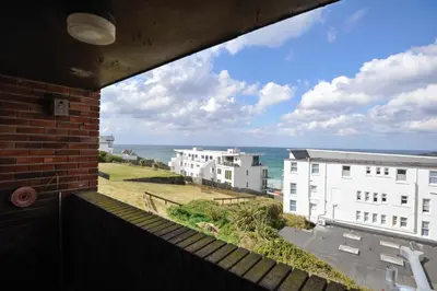 a view of the ocean from the balcony of a building at South Fistral View Apartment in Newquay