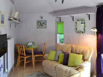 a living room with a couch and a table at Beach Retreat - Ukc2322 in Carbis Bay