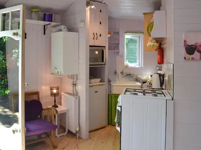 a small kitchen with a stove and a sink at Beach Retreat - Ukc2322 in Carbis Bay