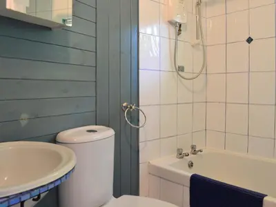 a bathroom with a toilet and a sink and a tub at Beach Retreat - Ukc2322 in Carbis Bay