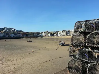 a barbed wire fence on a sandy beach at Anchorage Guest House, St Ives in St Ives