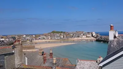 a view of a beach with houses and the ocean at Anchorage Guest House, St Ives in St Ives