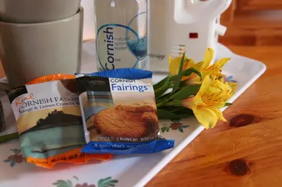 a plate with two bags of food on a table at Mandeley Guest House in Helston