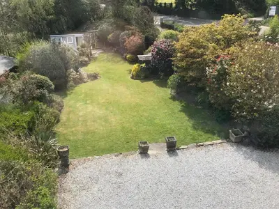 an aerial view of a garden with a lawn at Glengarth in Penryn