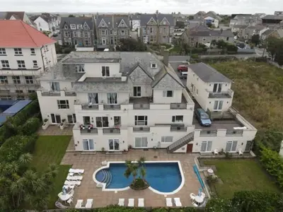 an aerial view of a large house with a swimming pool at Priory Lodge Hotel in Newquay