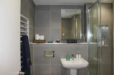 a bathroom with a sink and a shower at Endcliffe in Falmouth