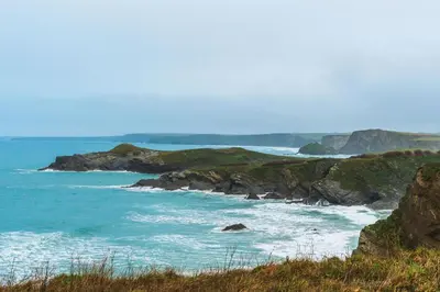 a view of the ocean with rocks in the water at Panoramic Sea-View Family Appartment , Free Parking, Sleeps 6 , Walk to Beach, Station, & Town in Newquay