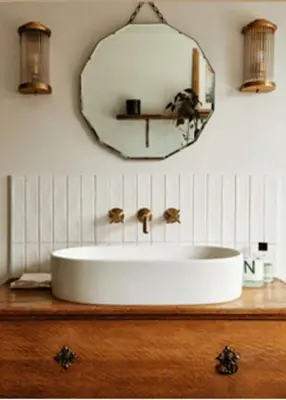 a bathroom with a white sink and a mirror at The Wellington Hotel in Boscastle