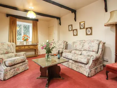 a living room with two couches and a table at Miller's House in Tintagel