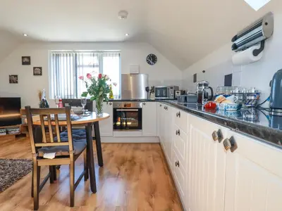 a kitchen with a table and a dining room at Sunnyvale in Bugle