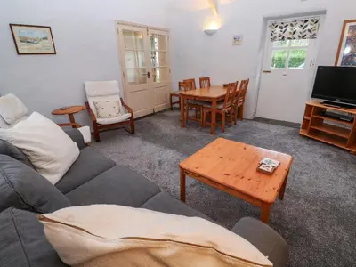 a living room with a couch and a table at Honeycrock in Cubert