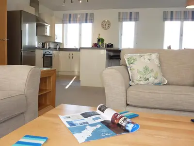 a living room with a couch and a table at 28 Clock Tower Court in Charlestown