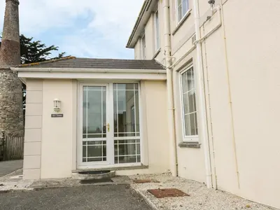 a house with a large window on the side of it at Apartment 1, Trearren in St. Agnes