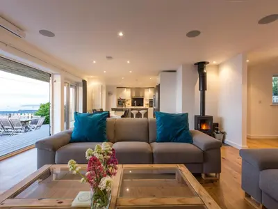 a living room with a couch and a table at Boscarne in St Ives