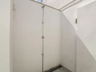 a room with white walls and a glass ceiling at 5 Ocean Heights in Newquay