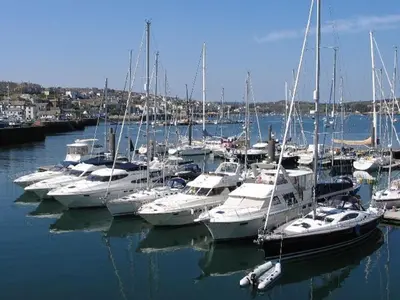 a bunch of boats are docked in a harbor at Omalast in Truro