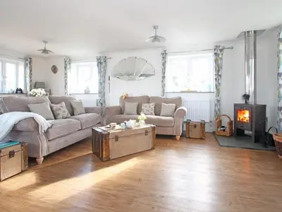a living room with a couch and a fireplace at Omalast in Truro