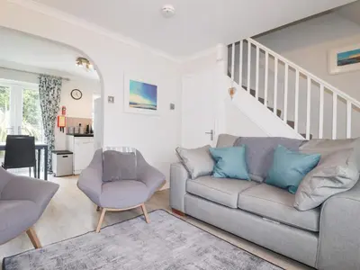 a living room with a couch and two chairs at Gull Cottage in Padstow