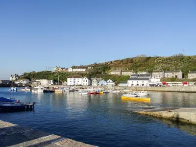 a group of boats are docked in a harbor at Wheal Grey in Germoe