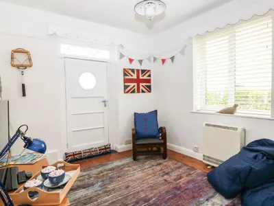 a living room with a flag on the wall at Bolenowe in Polzeath