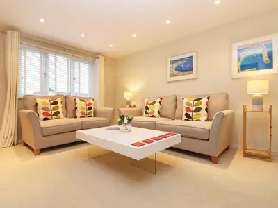a living room with two couches and a coffee table at Chy Kerris, Carbis Bay in Carbis Bay