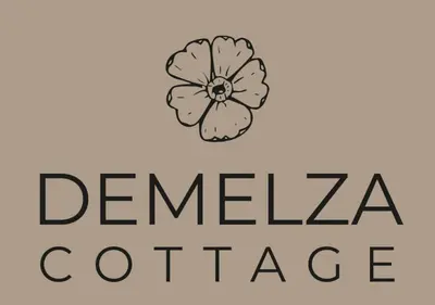 a logo for a geneva coffee company with a flower at Demelza Cottage Apartment in Bodmin