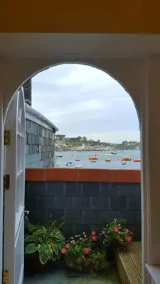 an archway with a view of a body of water at Polmarine in Polruan