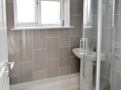 a bathroom with a shower and a sink at Lindum Leys in Saint Hilary