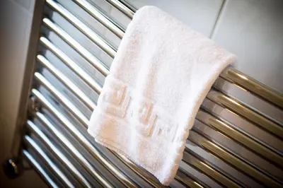 a towel is hanging on the back of a bench at Cargurra Park Farm in Boscastle