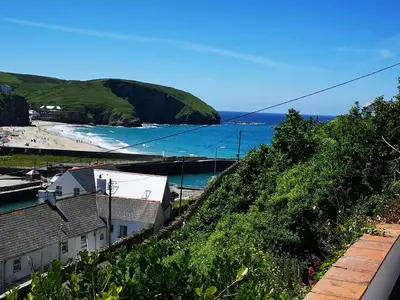 a view of a beach and the ocean at The Haven in Portreath