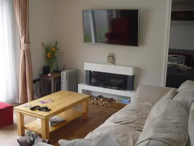 a living room with a couch and a table at Peacehaven in Liskeard