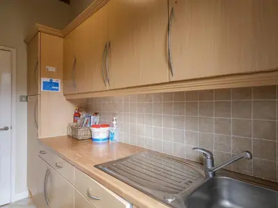 a kitchen with a sink and a counter top at High Tide in Wadebridge