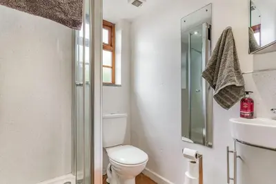 a bathroom with a toilet and a sink at Victoria Cottage in Newquay