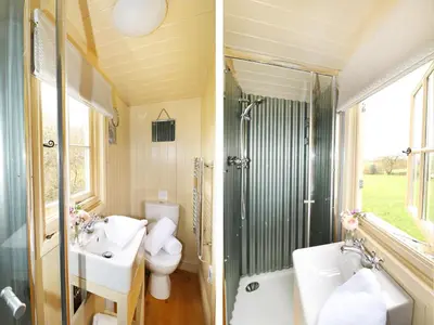 a bathroom with a toilet and a sink and a shower at Bramble in Wadebridge