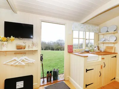 a kitchen with a sink and a window at Bramble in Wadebridge