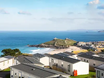 a view of a beach with houses and the ocean at Chy Lowen in St Ives